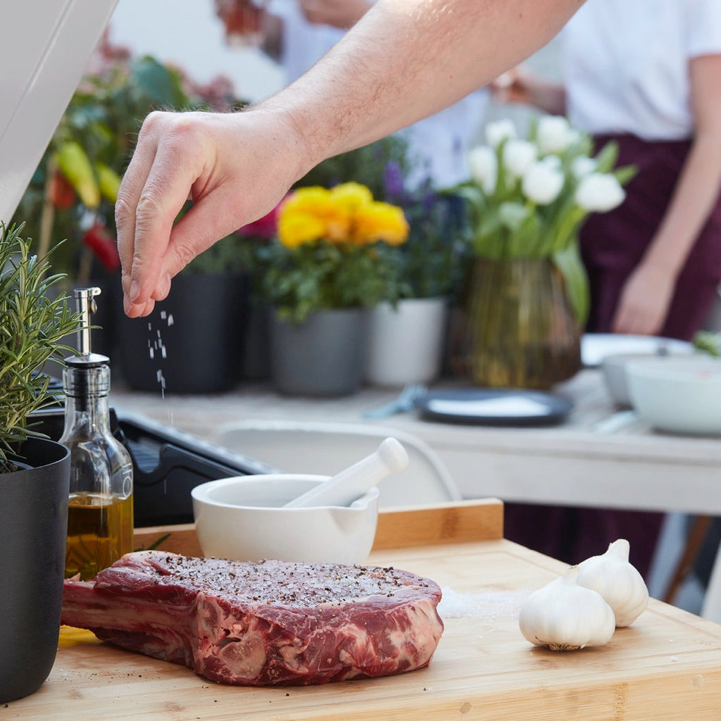 Côte à l'os with puffed garlic on the BBQ